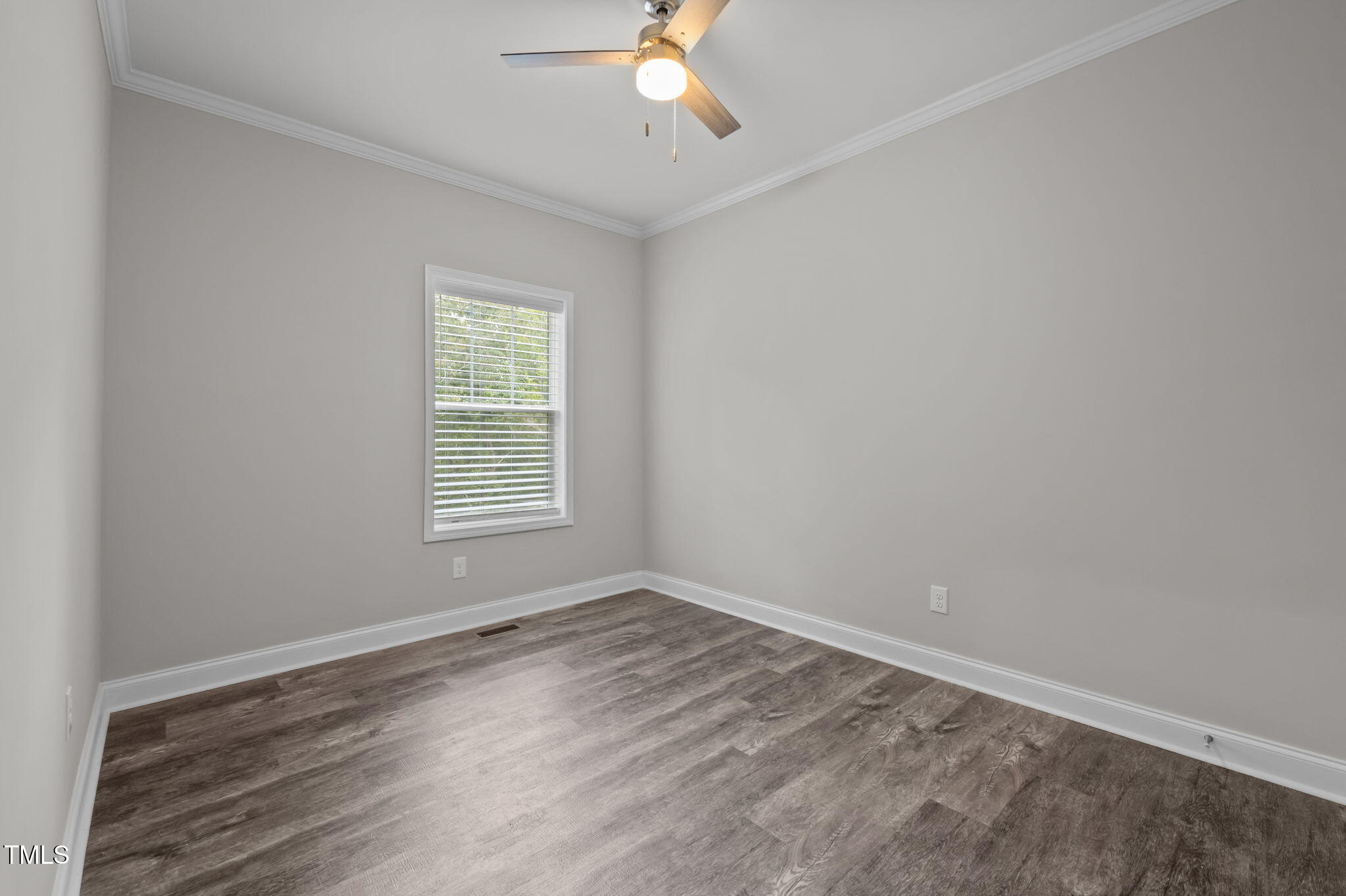 221 Country Lane Timberlake, NC 27583 - Photo 19 of 39 wooden floor in an empty room with a window