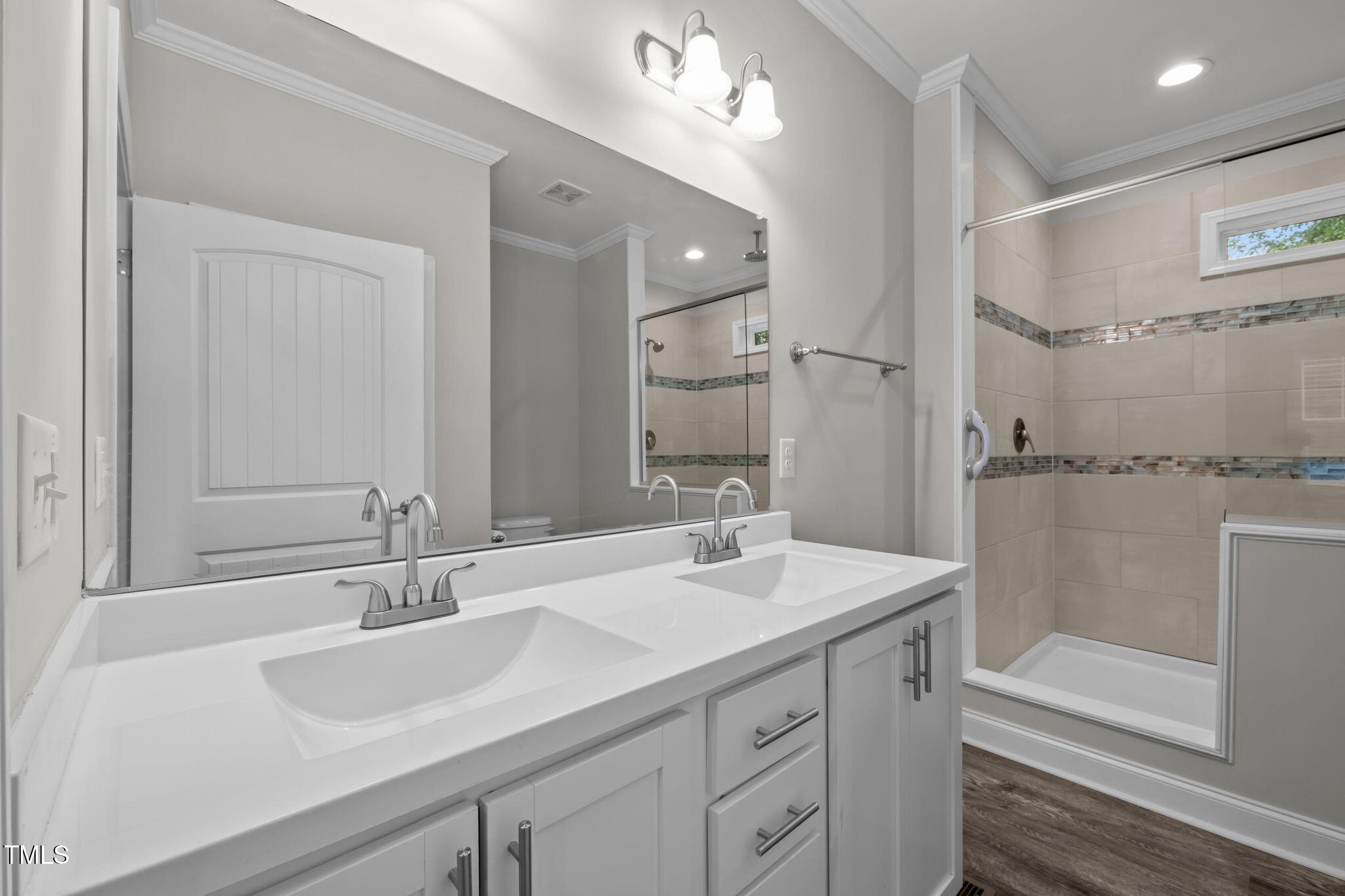 221 Country Lane Timberlake, NC 27583 - Photo 20 of 39 a bathroom with a sink double vanity granite tub shower and a mirror