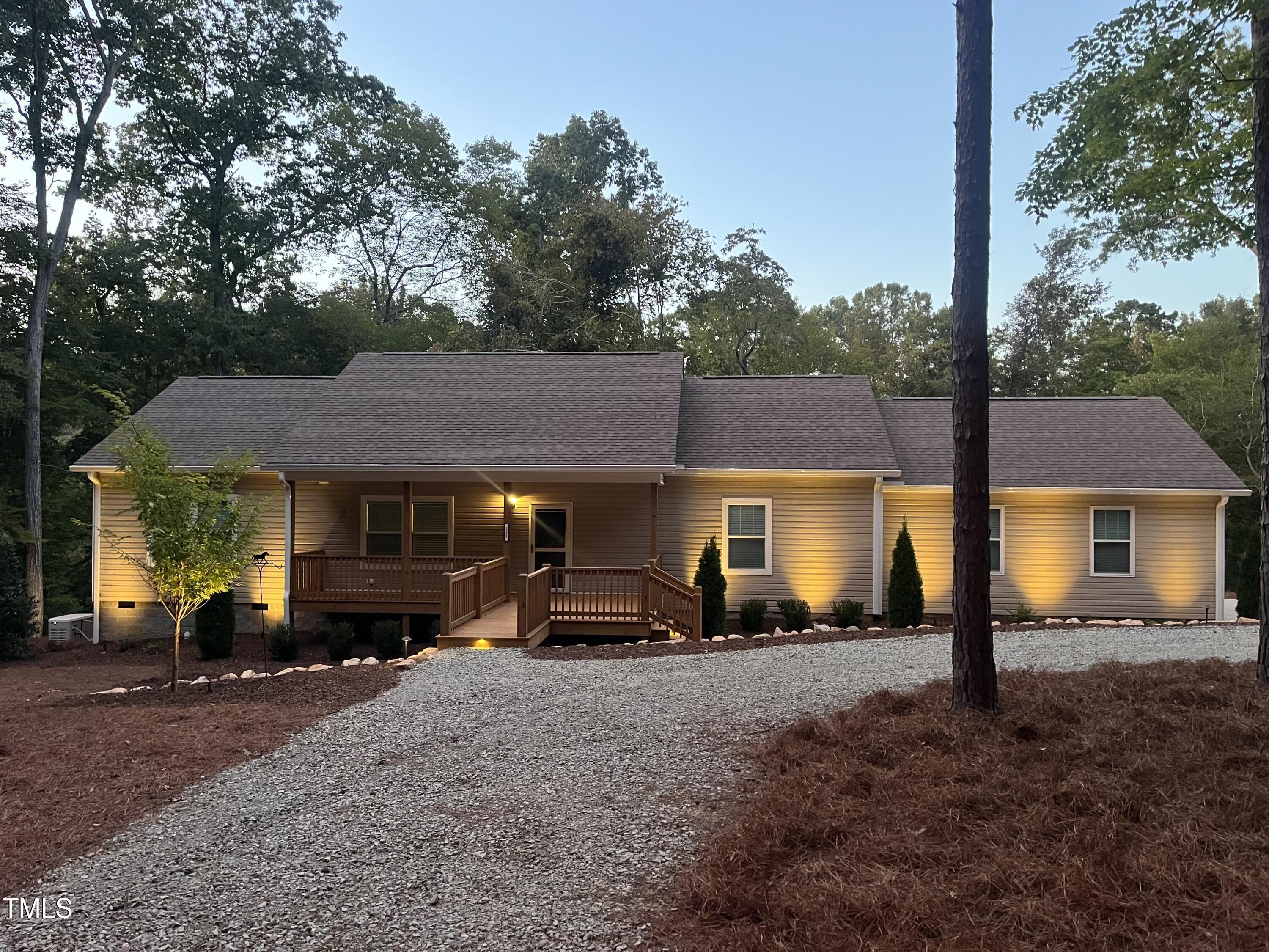 221 Country Lane Timberlake, NC 27583 - Photo 2 of 39 a car parked in front of a house