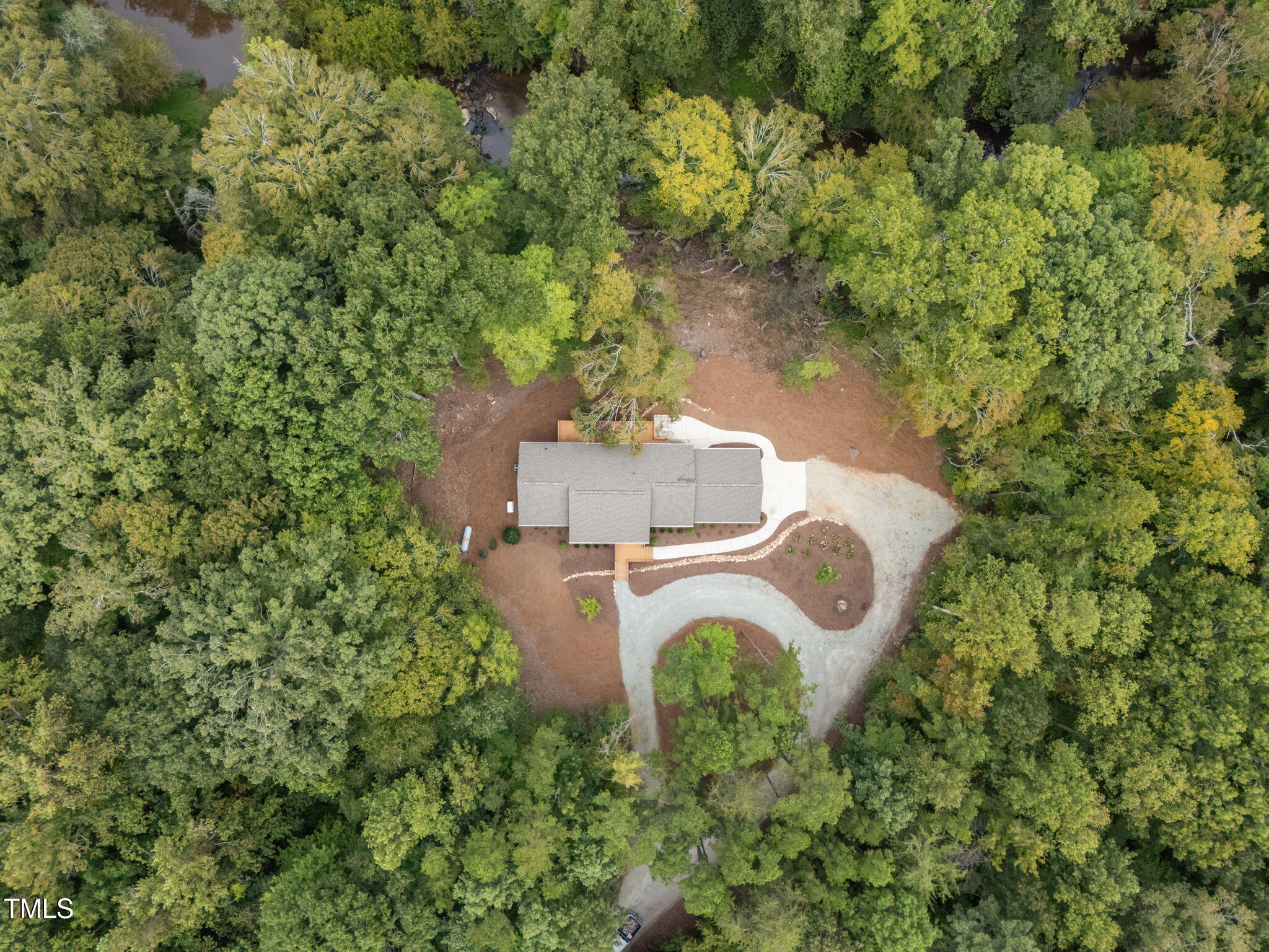 221 Country Lane Timberlake, NC 27583 - Photo 34 of 39 an aerial view of residential house with outdoor space and trees all around