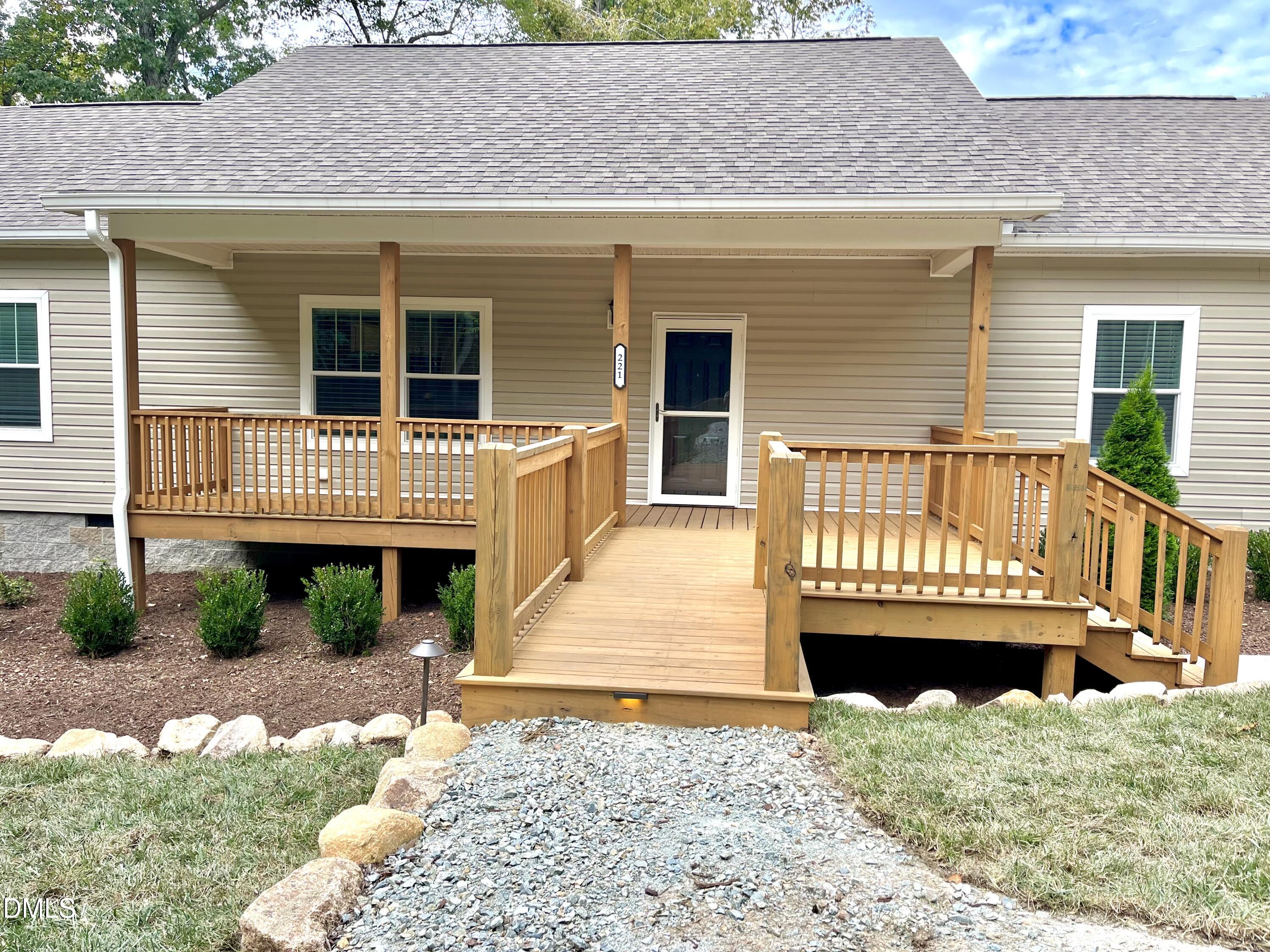 221 Country Lane Timberlake, NC 27583 - Photo 5 of 39 front view of a house with a yard