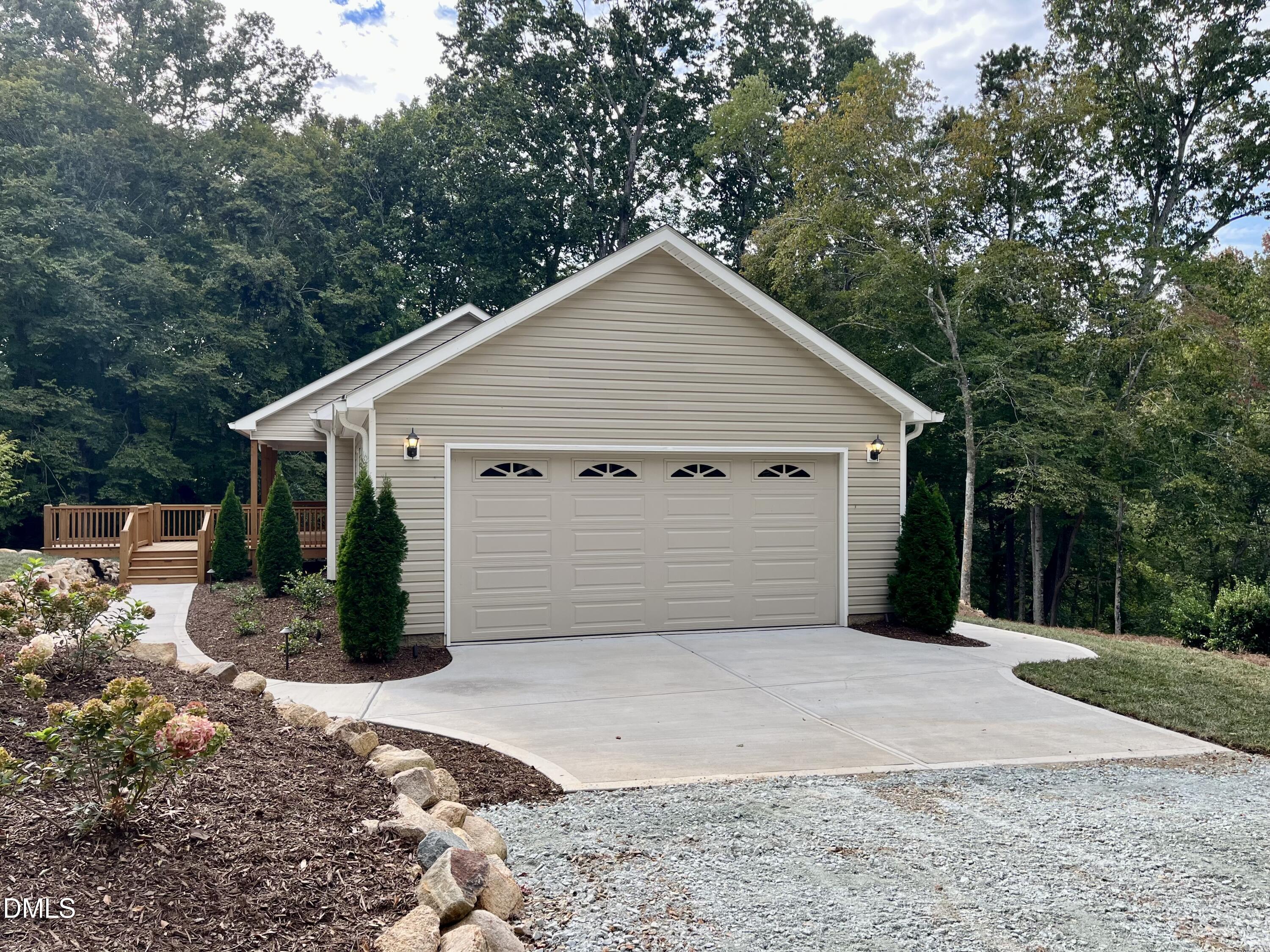 221 Country Lane Timberlake, NC 27583 - Photo 7 of 39 a view of a house with a yard and garage