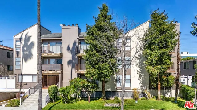 front view of a building with a garden