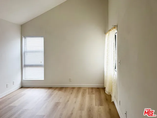 a bathroom with a granite countertop sink and a bathtub