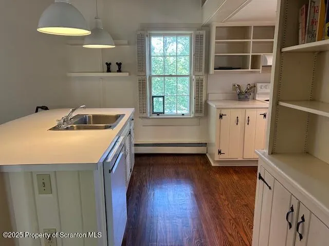 a kitchen with a sink a refrigerator and window