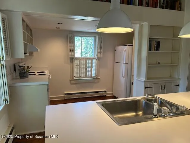 a kitchen with a sink and cabinet