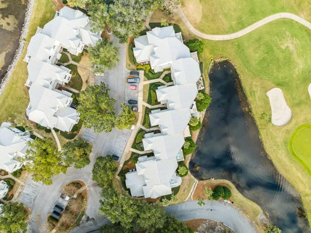 an aerial view of a house with a swimming pool
