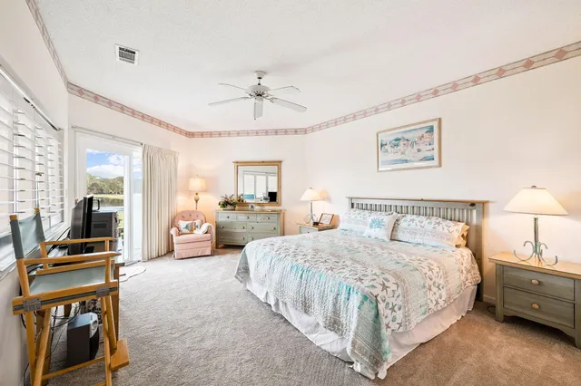 a spacious bedroom with a bed and furniture