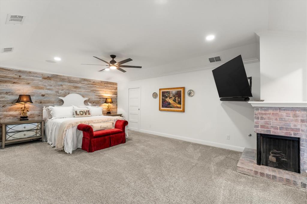 5505 Northaven Road Dallas, TX 75229 - Photo 25 of 40 Carpeted bedroom with recessed lighting, visible vents, baseboards, and a fireplace