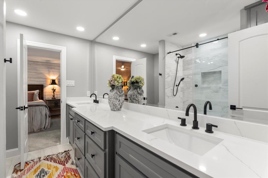 5505 Northaven Road Dallas, TX 75229 - Photo 39 of 40 Bathroom featuring a sink, visible vents, a shower stall, and ensuite bathroom