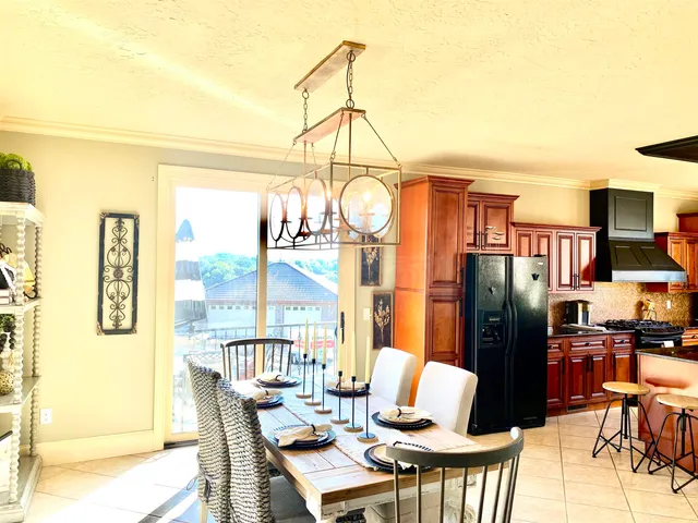 a bathroom with a granite countertop tub and a mirror