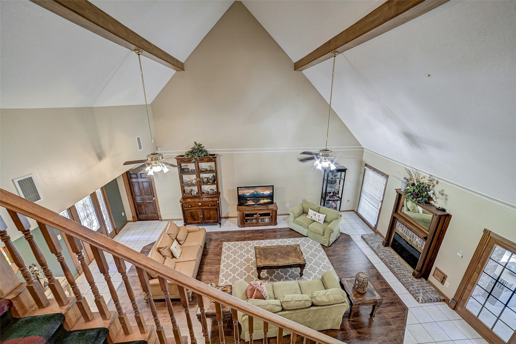 29803 Huffman Cleveland Road Huffman, TX 77336 - Photo 12 of 49 a living room with furniture and a flat screen tv