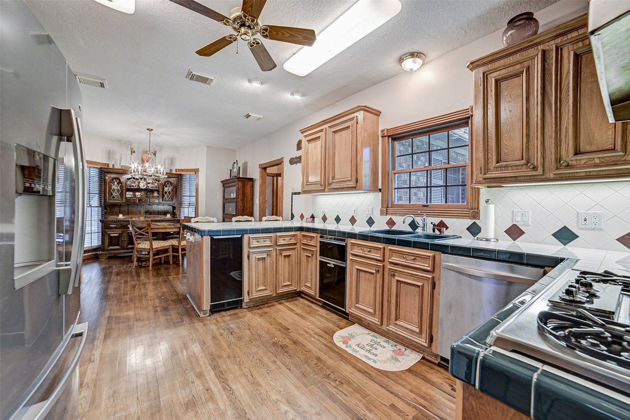 29803 Huffman Cleveland Road Huffman, TX 77336 - Photo 15 of 49 a kitchen with lots of counter top space and stainless steel appliances