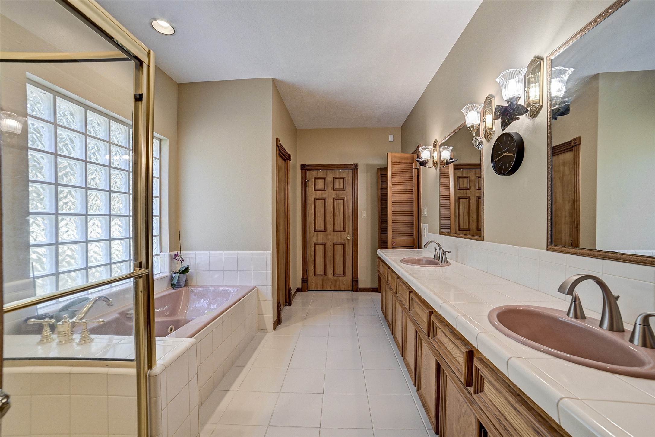 29803 Huffman Cleveland Road Huffman, TX 77336 - Photo 21 of 49 a bathroom with a tub sink and mirror