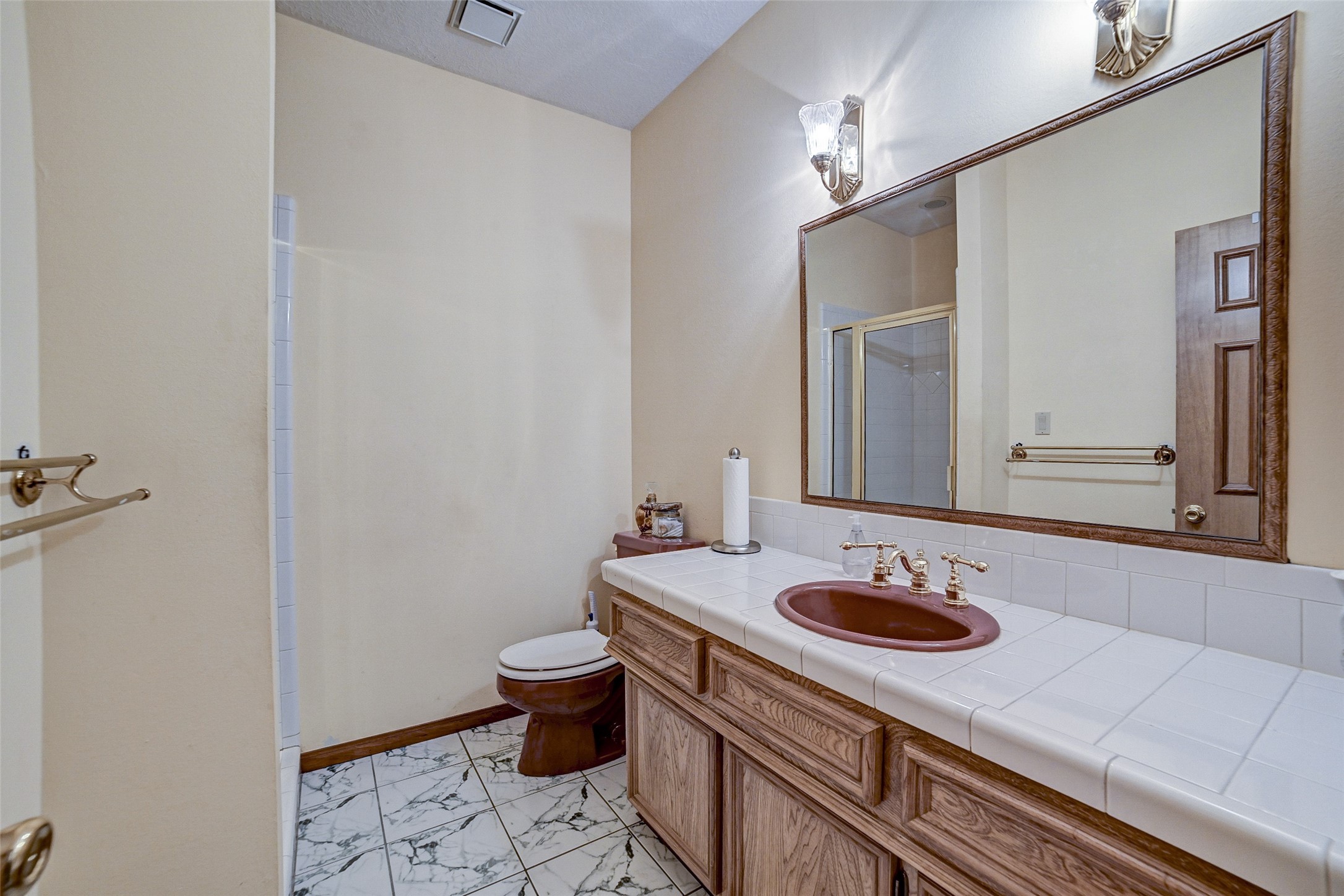 29803 Huffman Cleveland Road Huffman, TX 77336 - Photo 23 of 49 a bathroom with a sink and a mirror