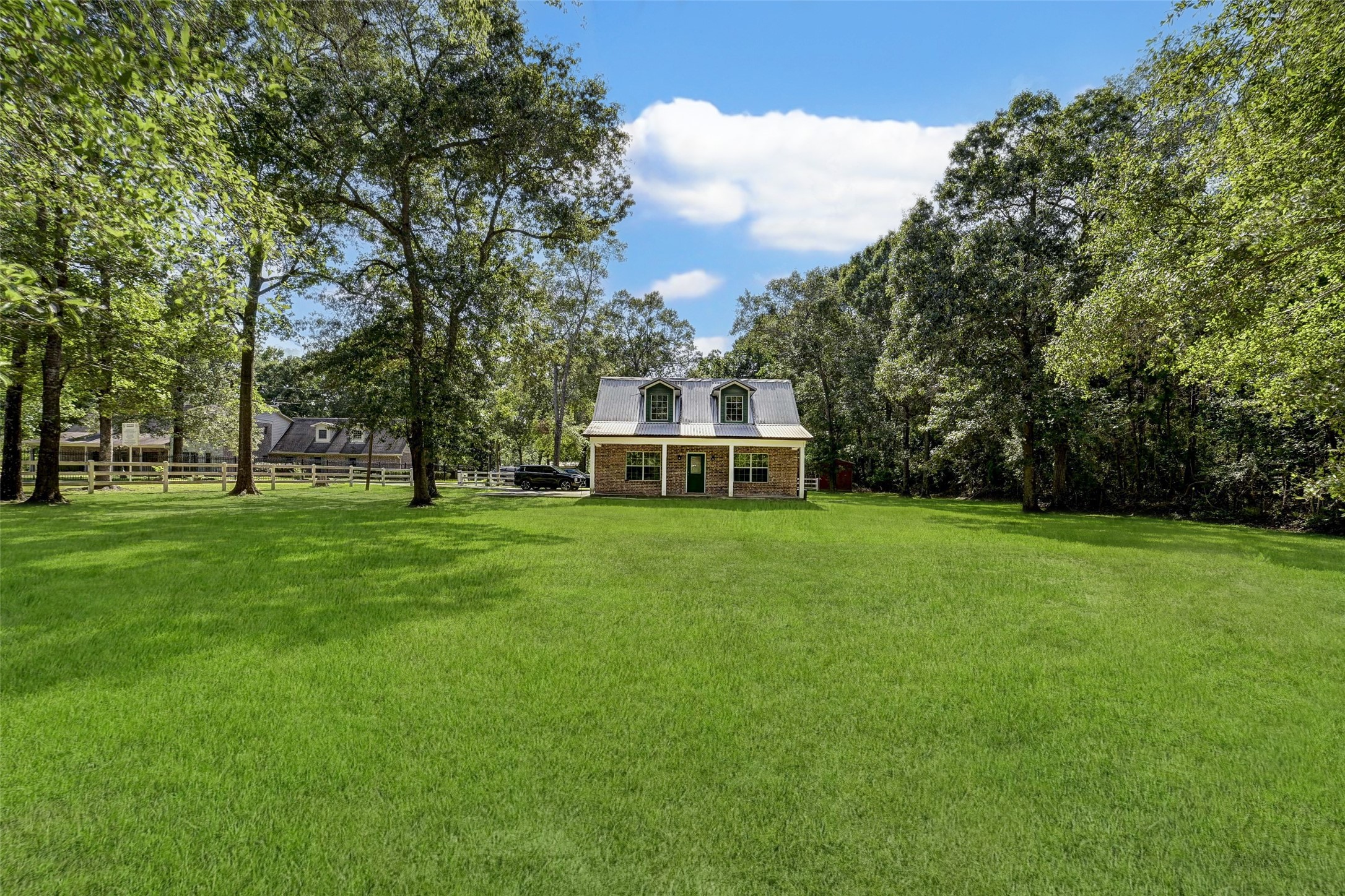 29803 Huffman Cleveland Road Huffman, TX 77336 - Photo 43 of 49 a view of a house with a big yard