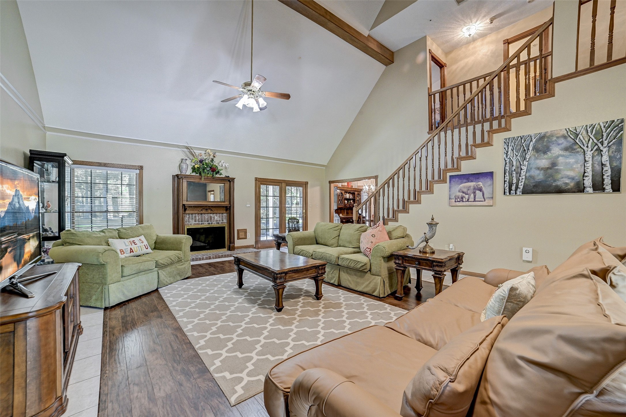 29803 Huffman Cleveland Road Huffman, TX 77336 - Photo 10 of 49 a living room with furniture wooden floor and a flat screen tv
