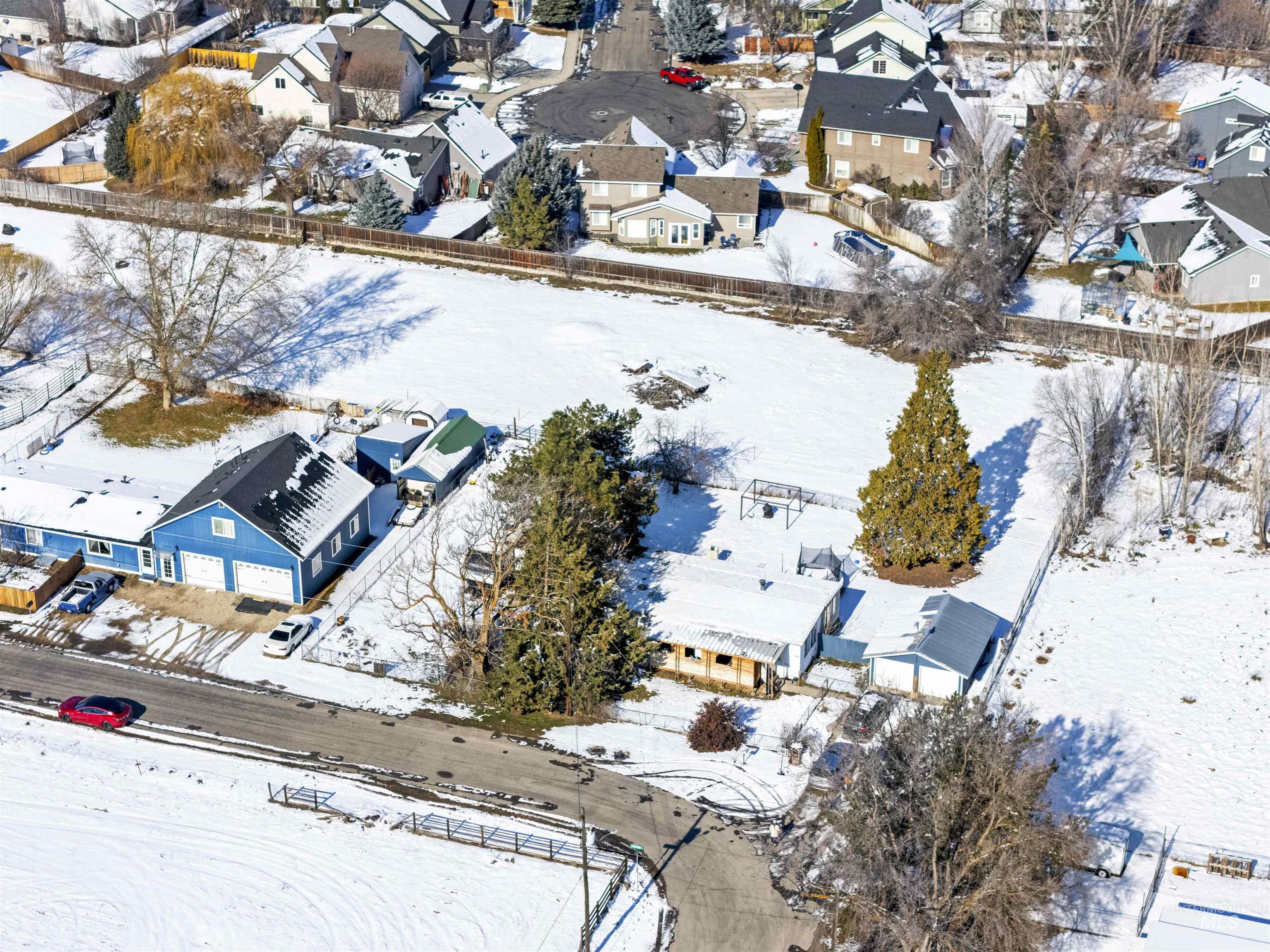 2382 East Syringa Street Eagle, ID 83616 - Photo 12 of 25 Snowy aerial view featuring a residential view