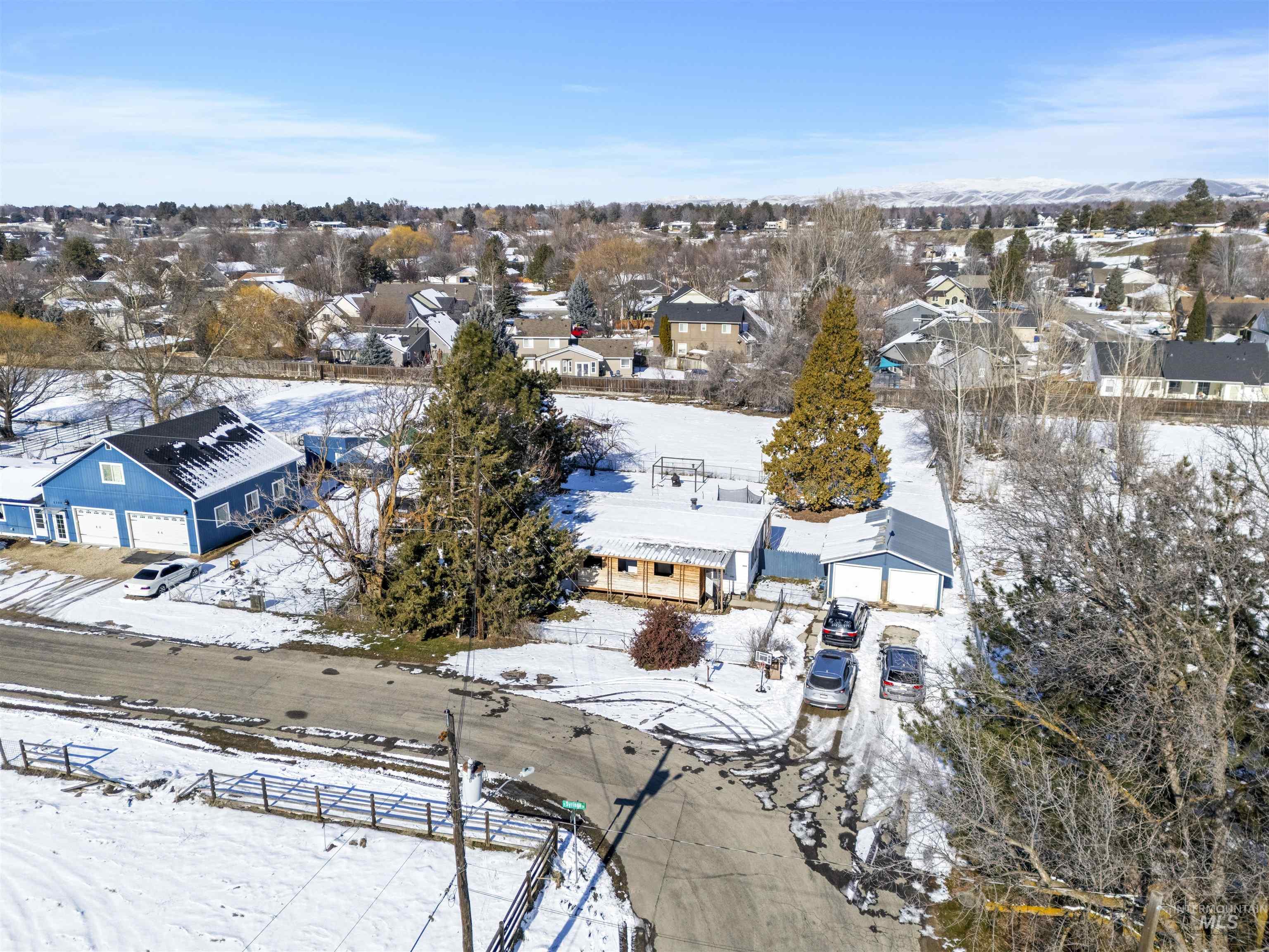 2382 East Syringa Street Eagle, ID 83616 - Photo 3 of 25 Snowy aerial view with a residential view
