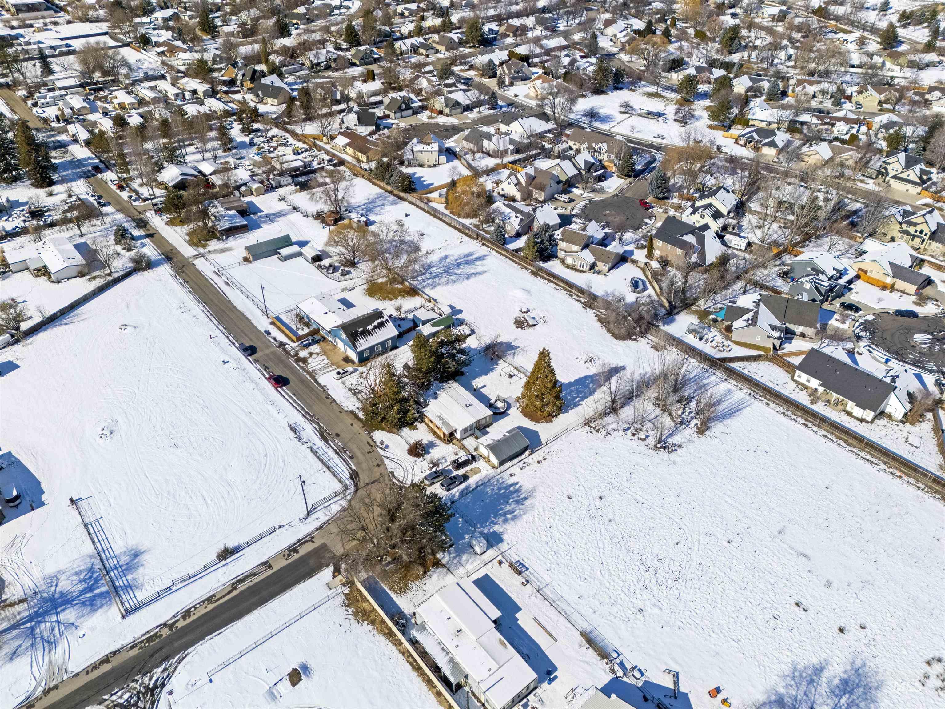 2382 East Syringa Street Eagle, ID 83616 - Photo 4 of 25 Snowy aerial view featuring a residential view