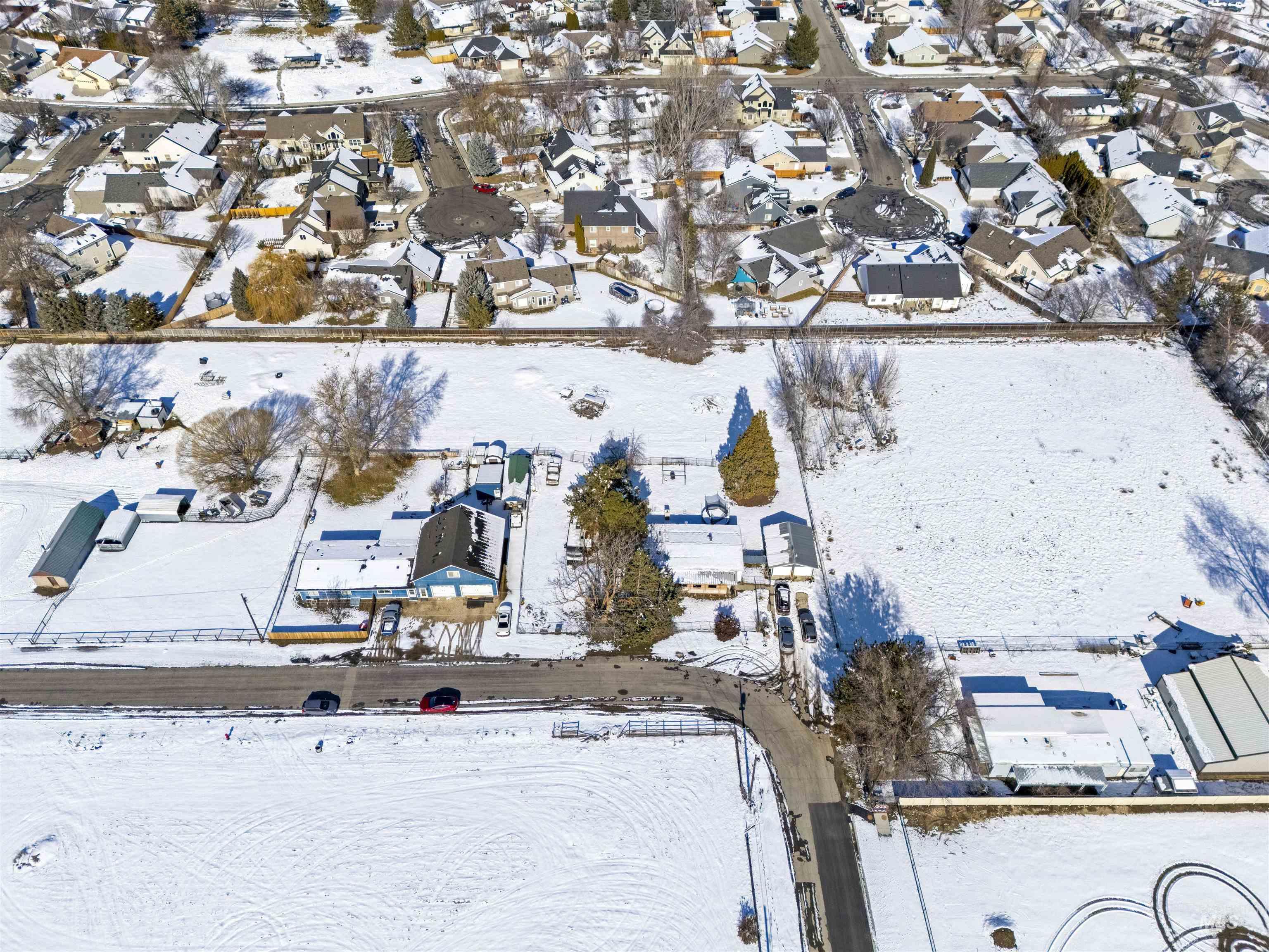 2382 East Syringa Street Eagle, ID 83616 - Photo 5 of 25 Snowy aerial view with a residential view