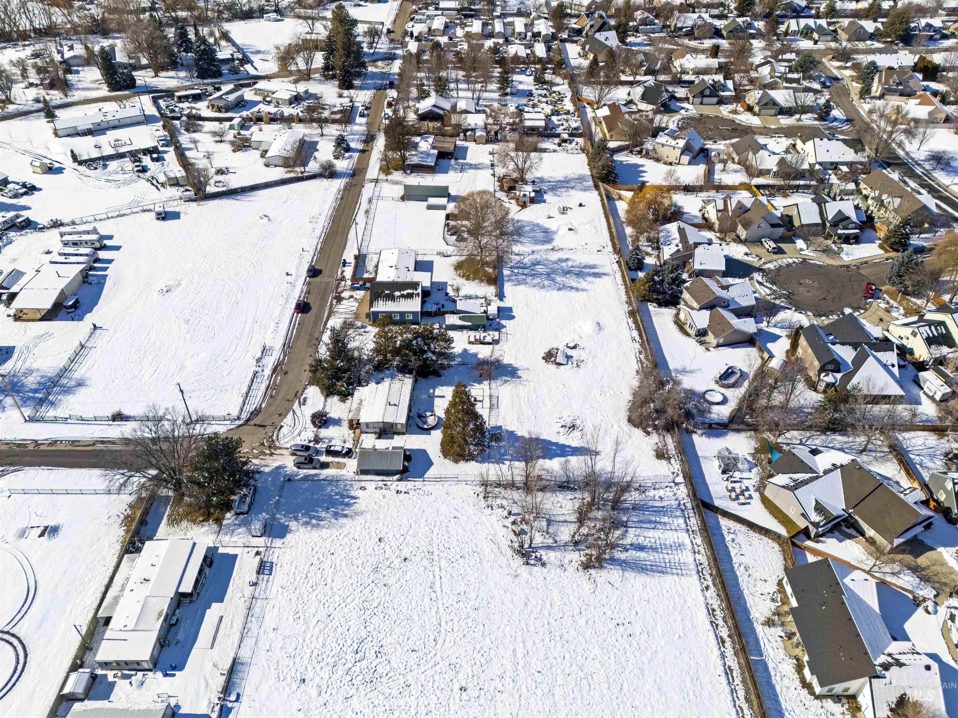 2382 East Syringa Street Eagle, ID 83616 - Photo 7 of 25 Snowy aerial view featuring a residential view
