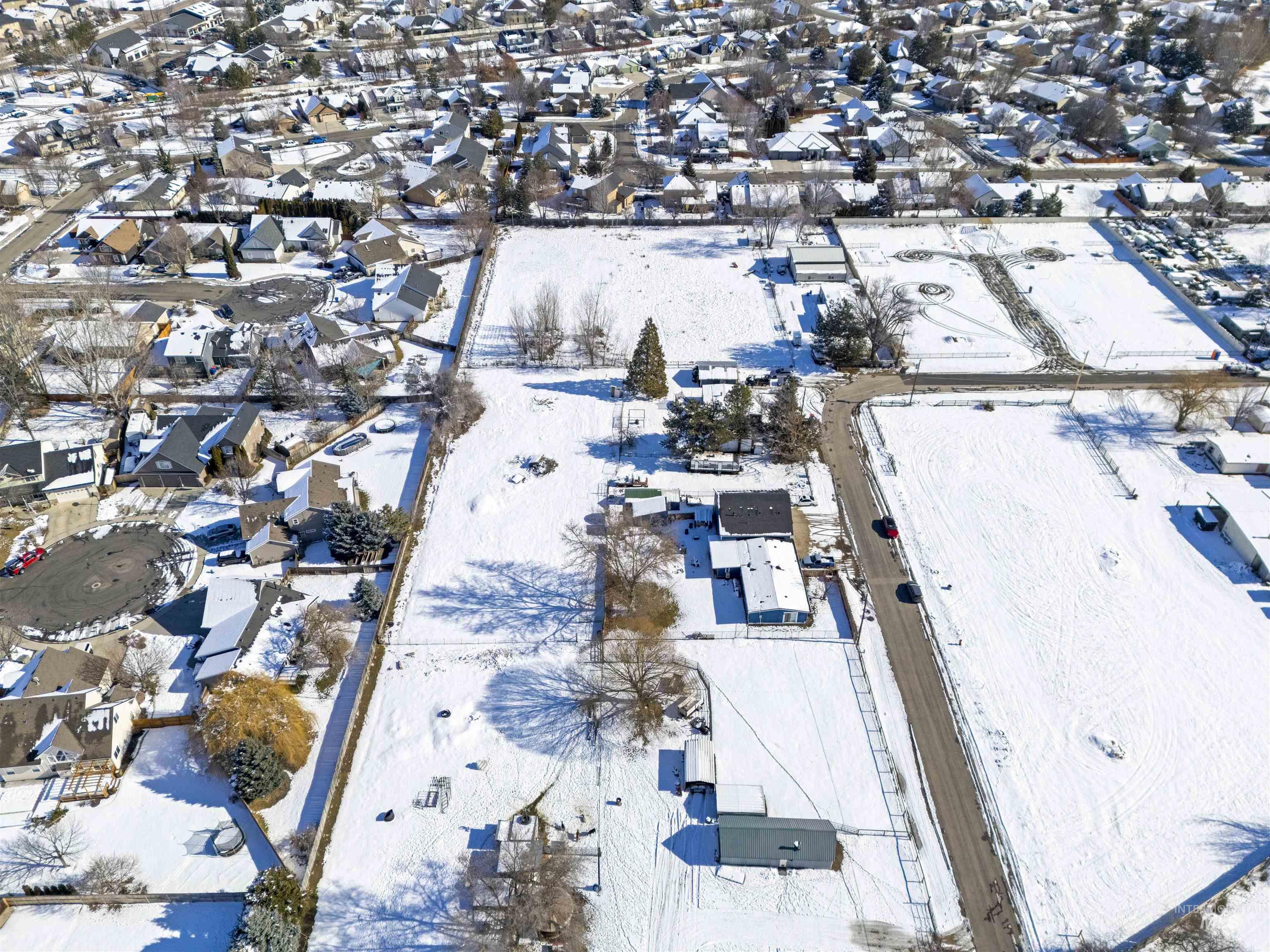 2382 East Syringa Street Eagle, ID 83616 - Photo 8 of 25 Snowy aerial view featuring a residential view