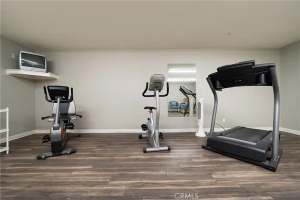 a view of a house with swimming pool and sitting area
