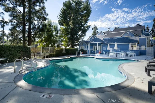 a view of a swimming pool with a lounge chair