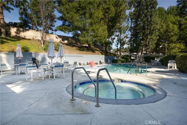 an aerial view of a houses with a swimming pool