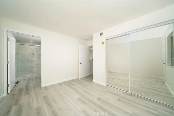 a bathroom with a shower sink and mirror