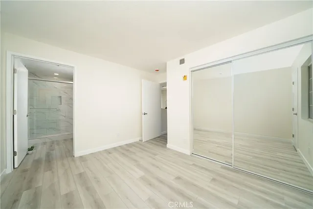 a bathroom with a shower sink and mirror