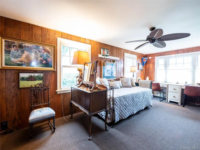 a bed room with furniture and a window