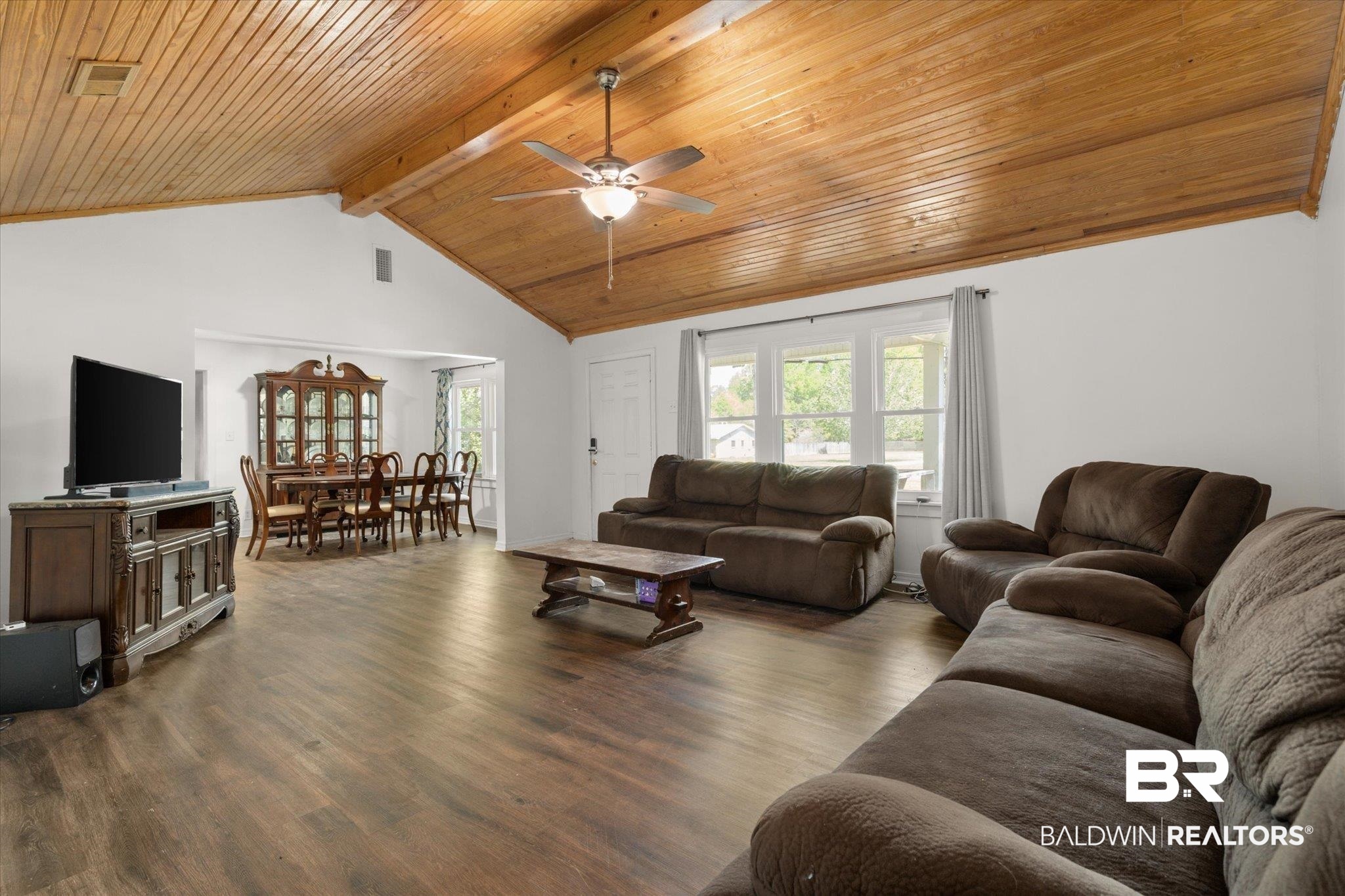 529 Cleveland Road Saraland, AL 36571 - Photo 3 of 31 Living area featuring ceiling fan, vaulted ceiling with beams, wood finished floors, and wood ceiling