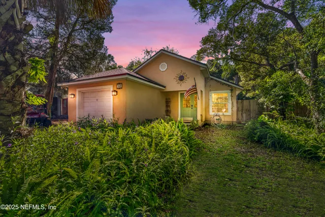 a front view of a house with garden