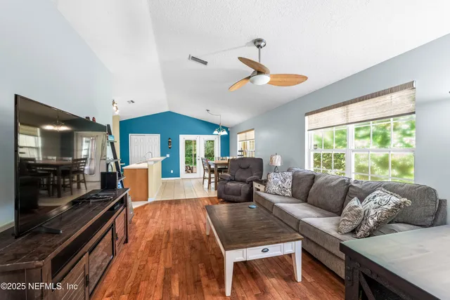 a view of a dining room with furniture window and wooden floor