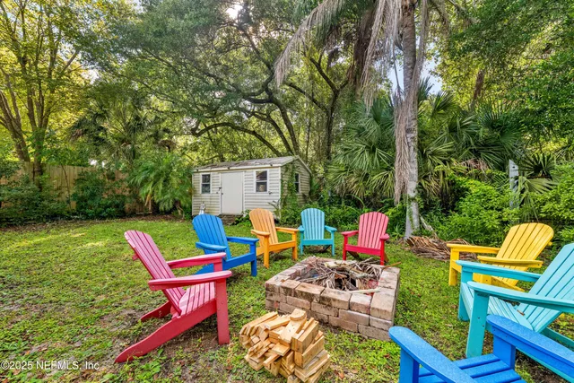 a view of yard with seating area and green space