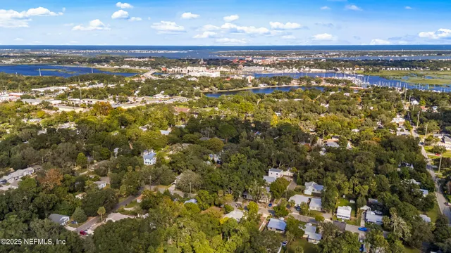 a bed room with a bed and a ceiling fan