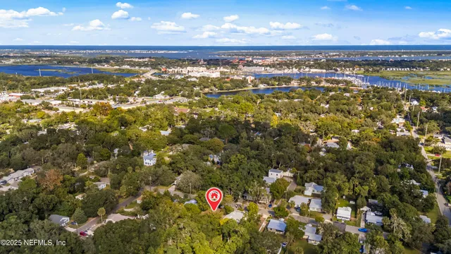a bed room with a bed and a ceiling fan