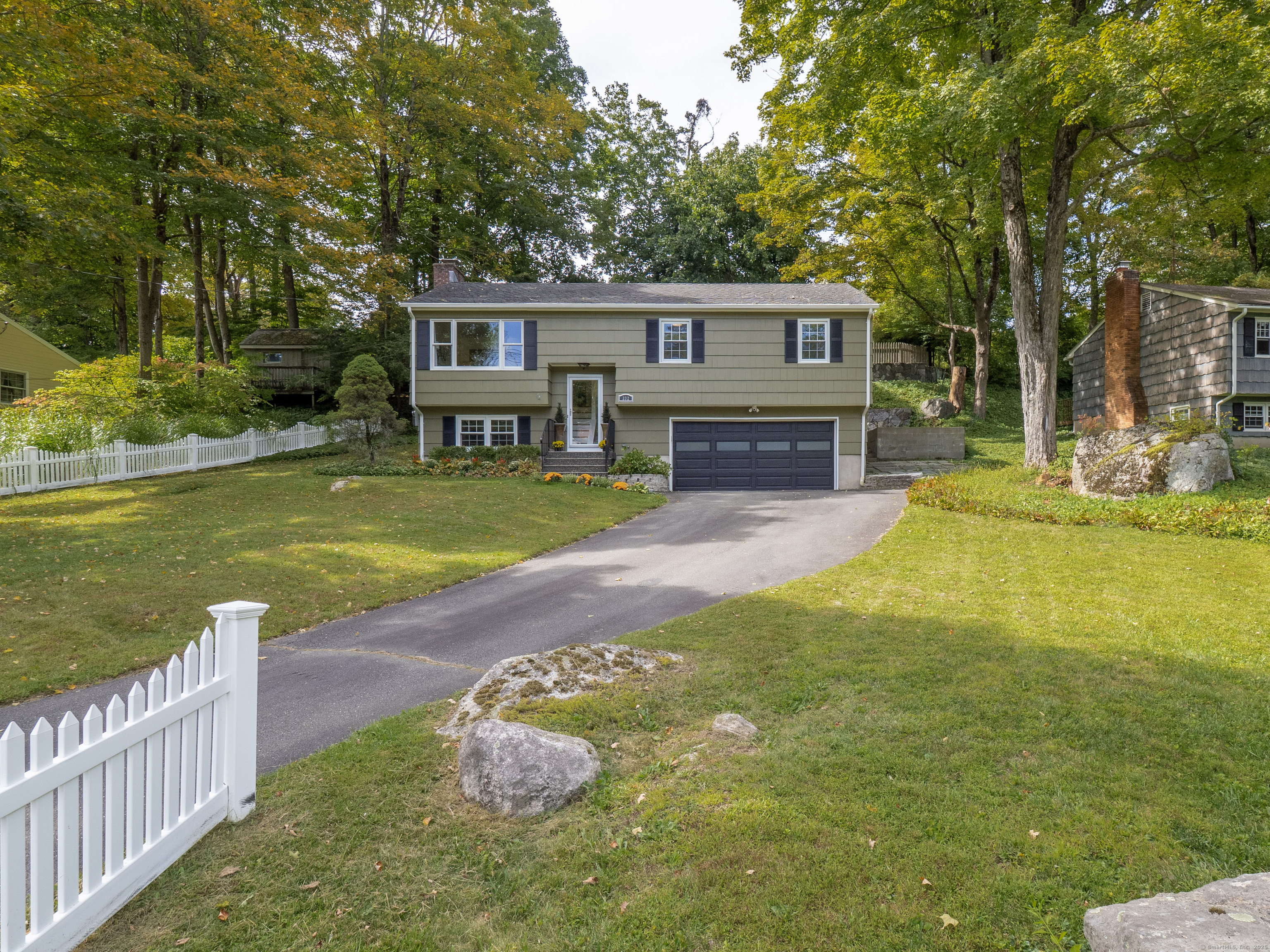 a view of a house with swimming pool and sitting area