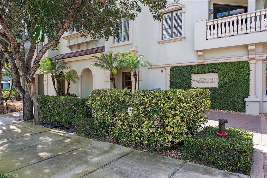 750 11th Street South, Unit C Naples, FL 34102 - Photo 22 of 25 a front view of a house with a yard