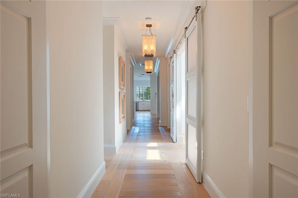 750 11th Street South, Unit C Naples, FL 34102 - Photo 8 of 25 a view of a hallway with a white walls