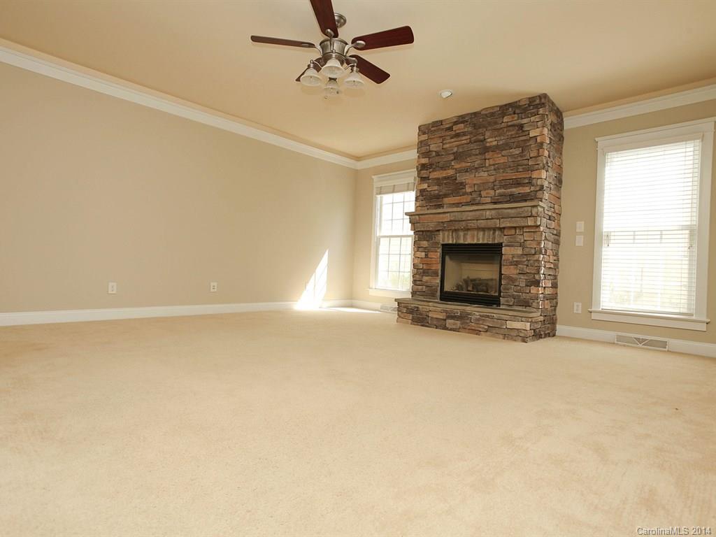 329 Third Baxter Street Fort Mill, SC 29708 - Photo 11 of 23 an empty room with windows and fireplace