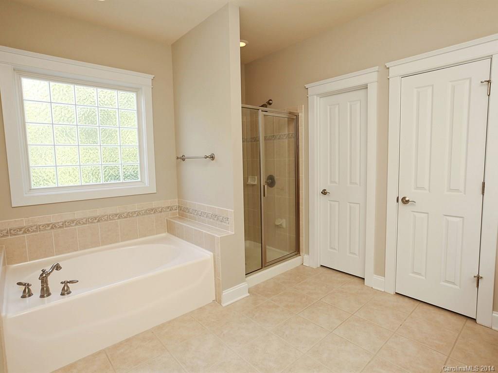 329 Third Baxter Street Fort Mill, SC 29708 - Photo 19 of 23 a bathroom with a bathtub and a shower