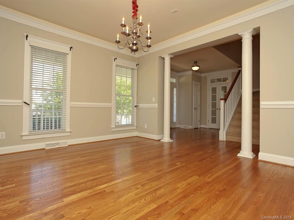 329 Third Baxter Street Fort Mill, SC 29708 - Photo 5 of 23 a view of an empty room with wooden floor and a window