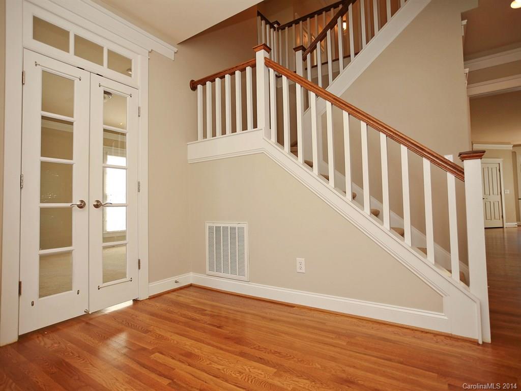 329 Third Baxter Street Fort Mill, SC 29708 - Photo 7 of 23 a view of an entryway with wooden floor and door