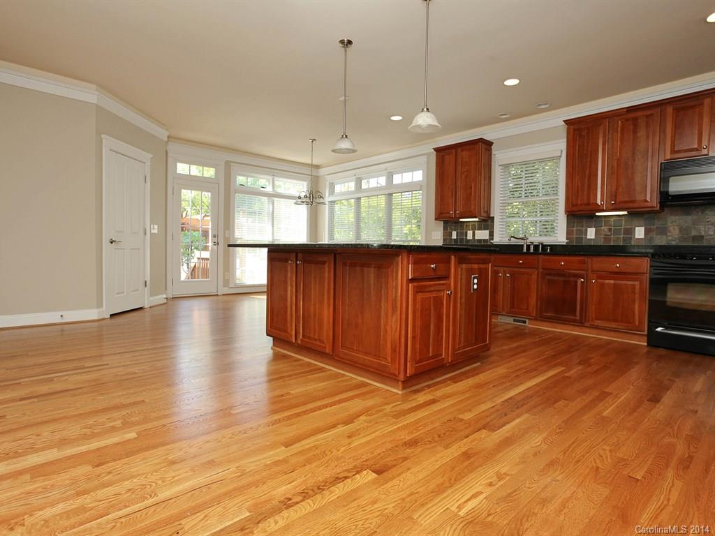 329 Third Baxter Street Fort Mill, SC 29708 - Photo 9 of 23 a large kitchen with stainless steel appliances granite countertop a stove a sink and a refrigerator