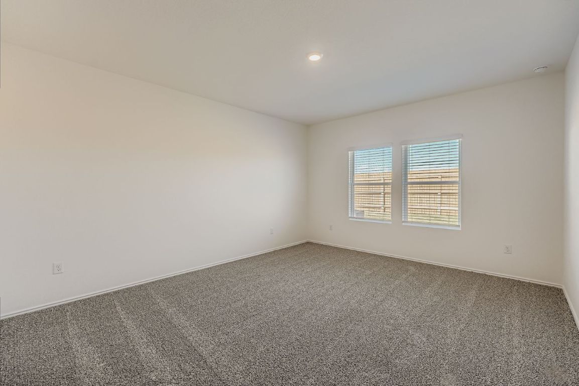 12112 Douglas Fir Circle Mustang Ridge, TX 78610 - Photo 17 of 33 an empty room with a window