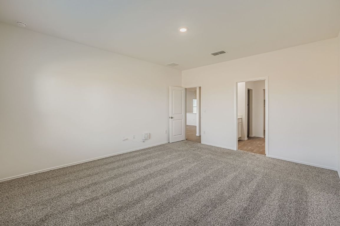 12112 Douglas Fir Circle Mustang Ridge, TX 78610 - Photo 19 of 33 a view of an empty room