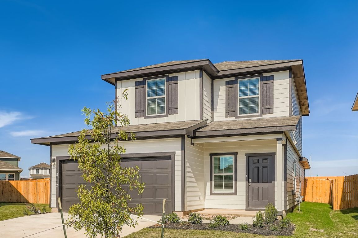 12112 Douglas Fir Circle Mustang Ridge, TX 78610 - Photo 2 of 33 front view of a house